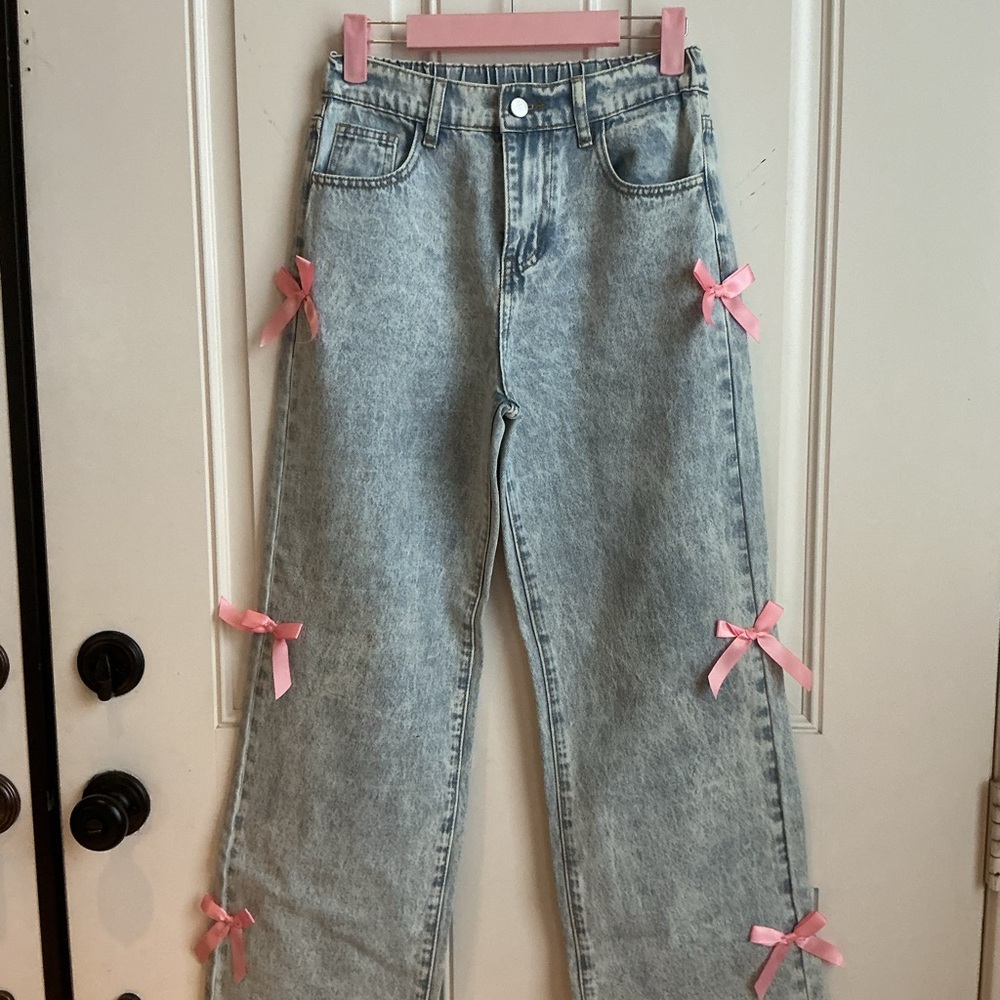 Light Blue Wide-Leg Jeans with Pink Bow Accents size 14/16